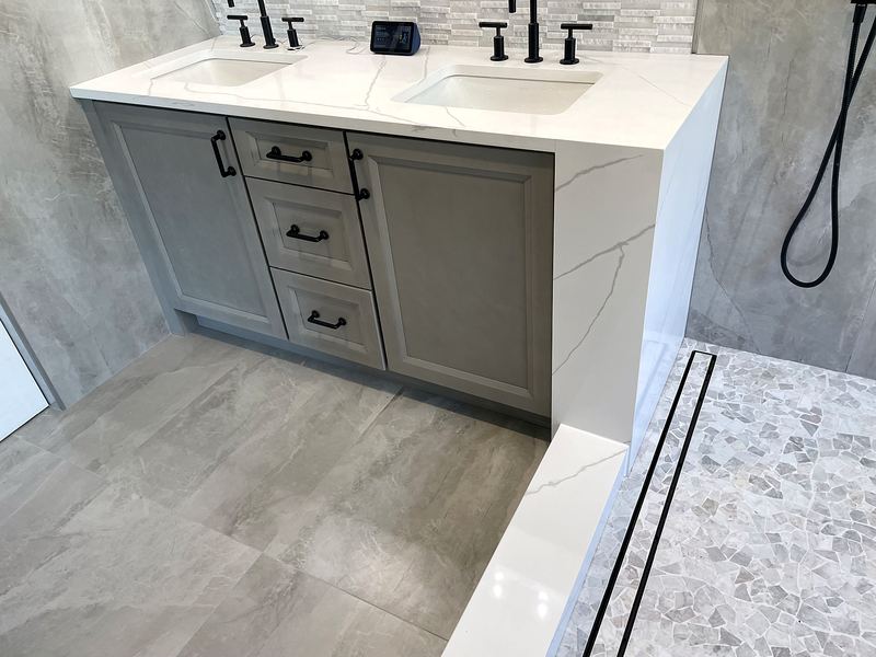 Double vanity with quartz top and terrazzo-look floor