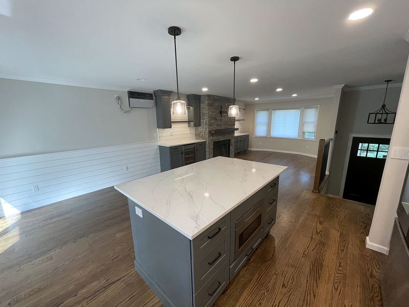 Kitchen remodel with white quartz island and gray cabinets